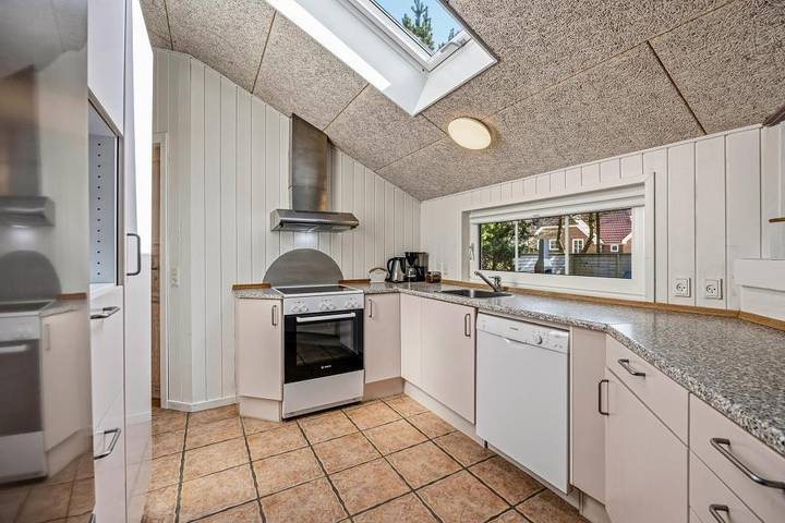 Cosy holiday home with a sauna, an indoor spa and a wood-burning stove on a natural plot in Blåvand in Ho, Varde Region