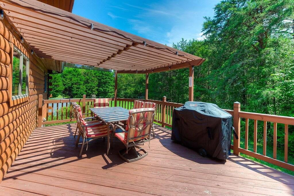 Three-story dog-friendly home with large deck, wood swing, firepit, lawn, & more in Lake Anna