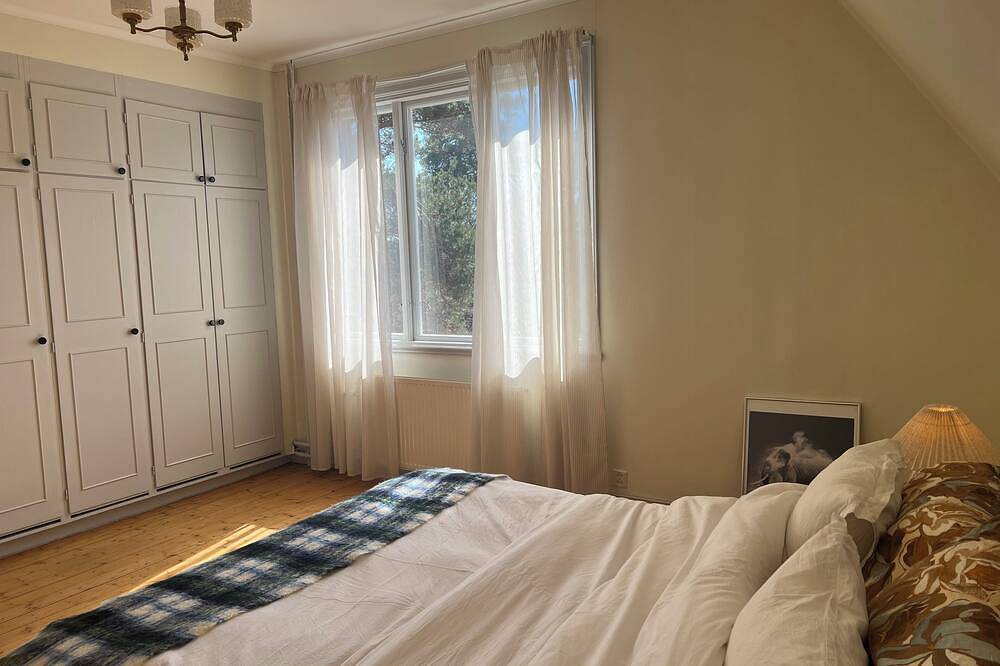 Semi-detached house near the sea, Gotland ferry and archipelago boats in Nynäshamn