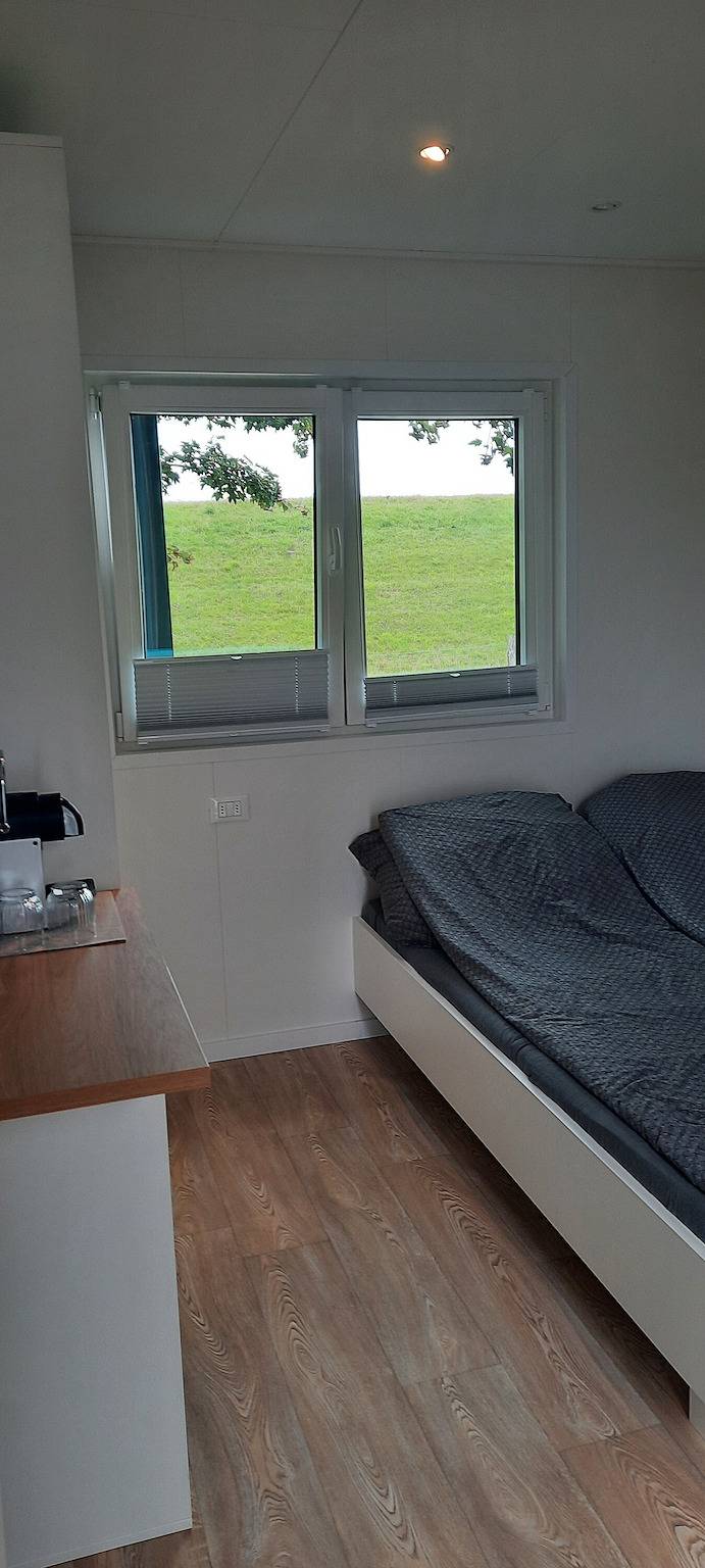 Gästehaus 'Surfbrett 1 – Zimmer mit Deichblick' mit Gemeinschaftsgarten und Wlan in Dahme, Ostholstein