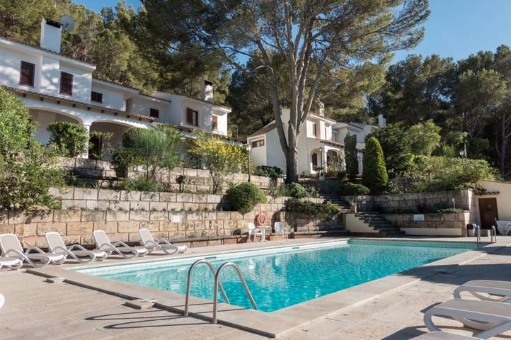 Location de vacances pour 7 personnes, avec balcon et jardin à Cala Sant Vicenc