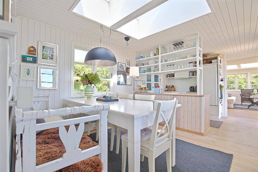 Wonderful beachfront holiday home with a large terrace and panoramic views of Knebel Cove – the perfect spot for tranquillity, nature and seaside living. in Knebel, South Djursland