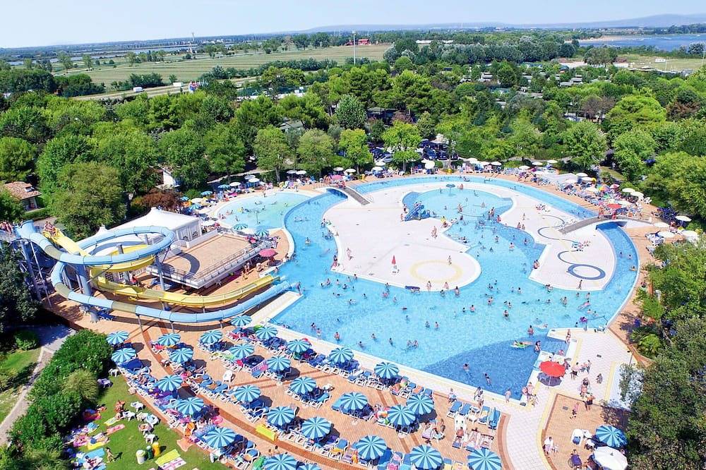 Angenehme Wohnung in einem Ferienhaus für 6 Personen mit  W-Lan, Klimaanlage, Pool und Terrasse in Grado, Görz Provinz