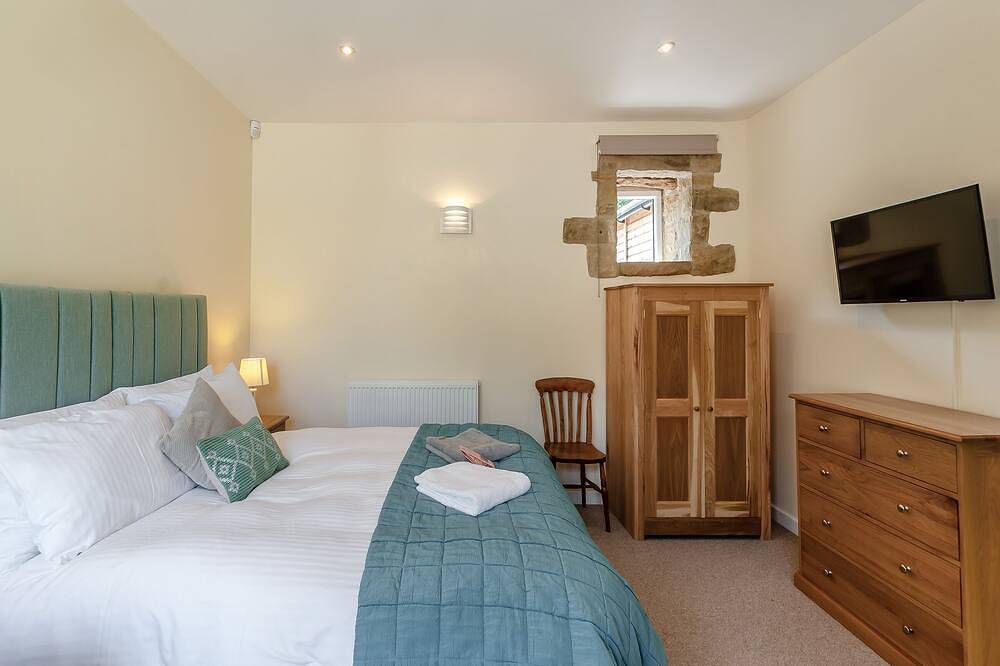 Church Cottage nestles in the grounds of the Old Vicarage in Darley Bridge. in South Darley, Derbyshire