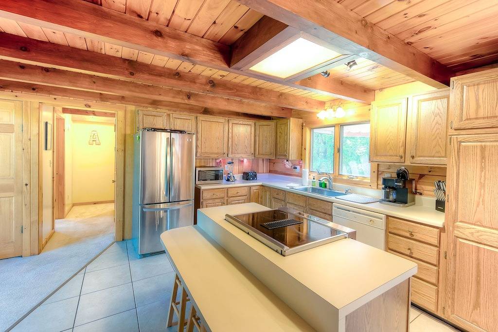 Three-story dog-friendly home with large deck, wood swing, firepit, lawn, & more in Lake Anna