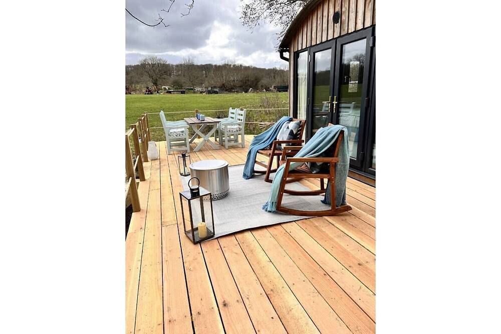 Boutique Shepherds Hut set in a wildflower meadow on a farm with Highland Cows in West Chiltington, South Downs