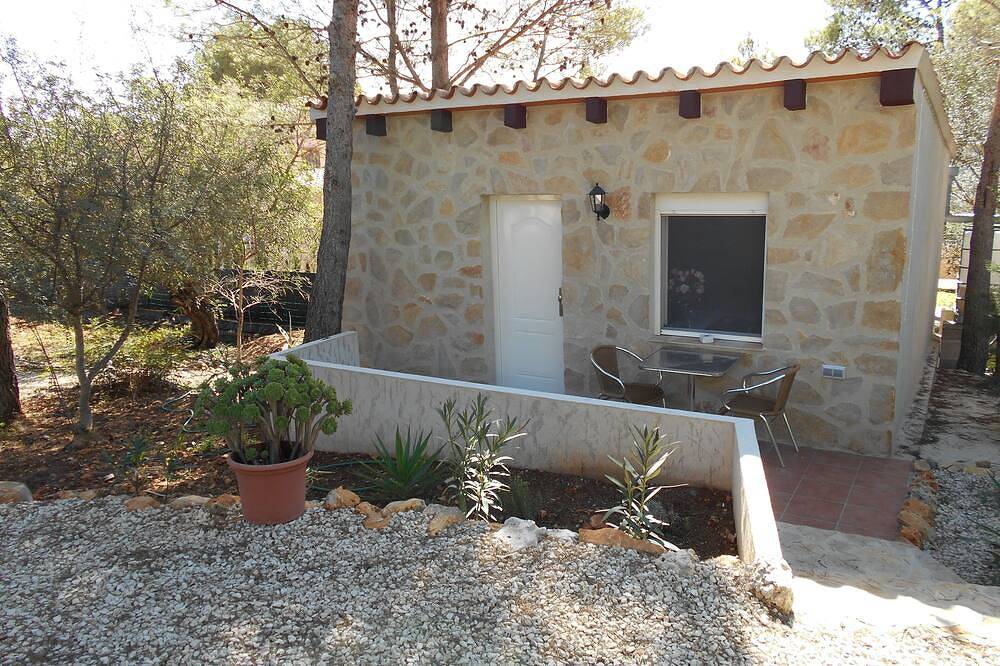 Finca Rustica con aire acondicionado y piscina comunitaria en una zona tranquila. in Xaló, Costa Blanca