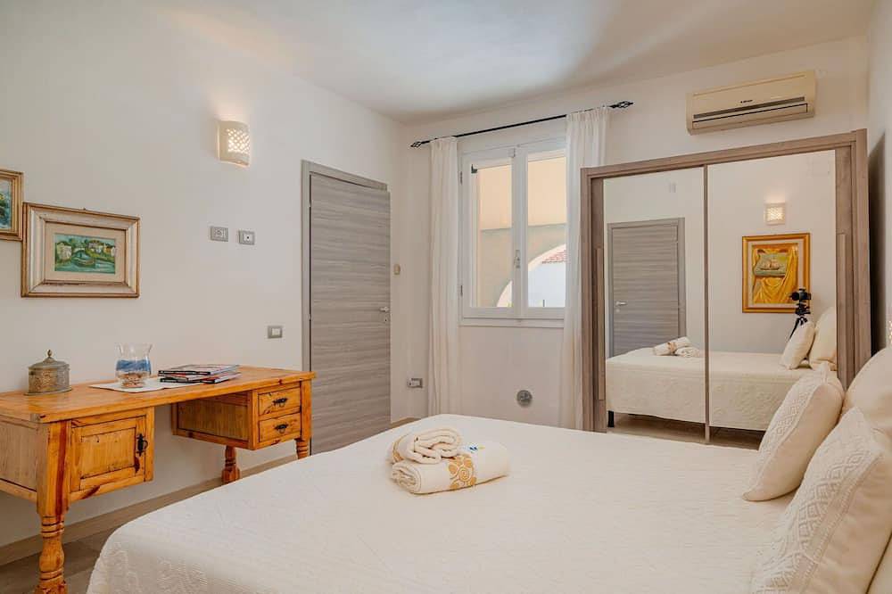 Schöne Wohnung in einem Ferienhaus für 5 Personen mit  W-Lan, Klimaanlage, Pool, Tv und Innenhof in Eden Beach, Sorso
