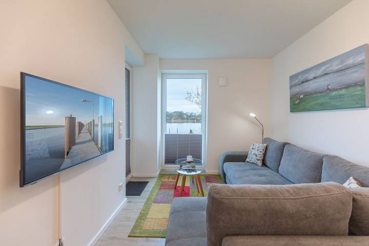 Ferienwohnung für 4 Personen, mit Terrasse und Garten sowie Seeblick und Ausblick in Nordstrand
