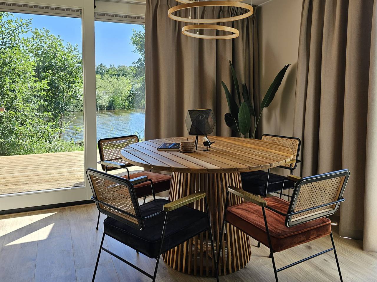 Charming 4-person tiny house with private jetty at a holiday park in Friesland in North Sea Netherlands